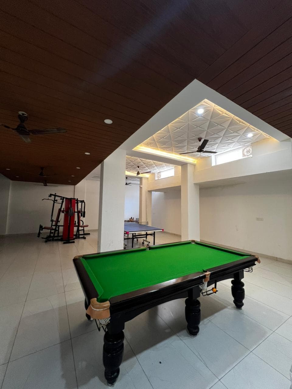 Recreation floor with pool table, table tennis and gym equipment